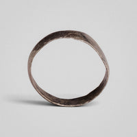 Silver band ring 'Ovata' shows its thin band edge and the inside of the complete hoop.