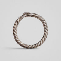 Medieval silver ring Hravnar upright, detail of two wires separating into opposing loops at the junction