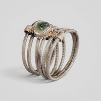 Medieval silver ring Ilmar, close view of green glass cabochon in beaded silver collet