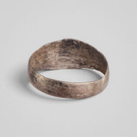 Silver band ring 'Ovata' shows its plain back band and the inside of its widened front.