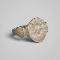 Medieval silver ring Wistrid, three-quarter view showing shaped shoulders and bezel