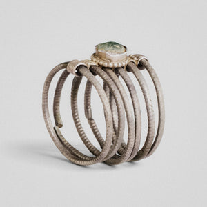 Medieval silver six-hoop ring Ilmar with green cabochon bezel, three-quarter view