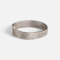 Roman silver ring 'Sextus' shows its plain band and bezel edge from the opposite side.