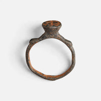 Byzantine bronze ring 'Monogrammos' shows the raised bezel neck above its complete hoop in profile.