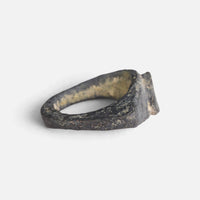 Roman bronze ring 'Equidus' shows the inside of its broad shoulders and the bezel edge.
