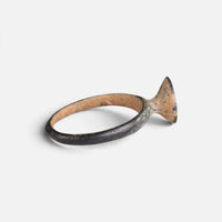 Byzantine bronze ring 'Peristerios' shows its raised bezel edge and narrow hoop from the side.