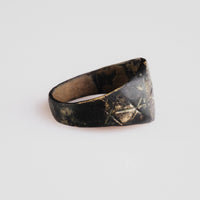 Profile of medieval bronze ring Astariel revealing D-section hoop and dark patina