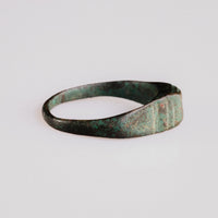 Profile of Roman bronze ring Numerius revealing tapered D-section hoop and malachite patina