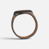 Byzantine bronze ring 'Kallisto' shows its complete hoop and the broad bezel edge in profile.