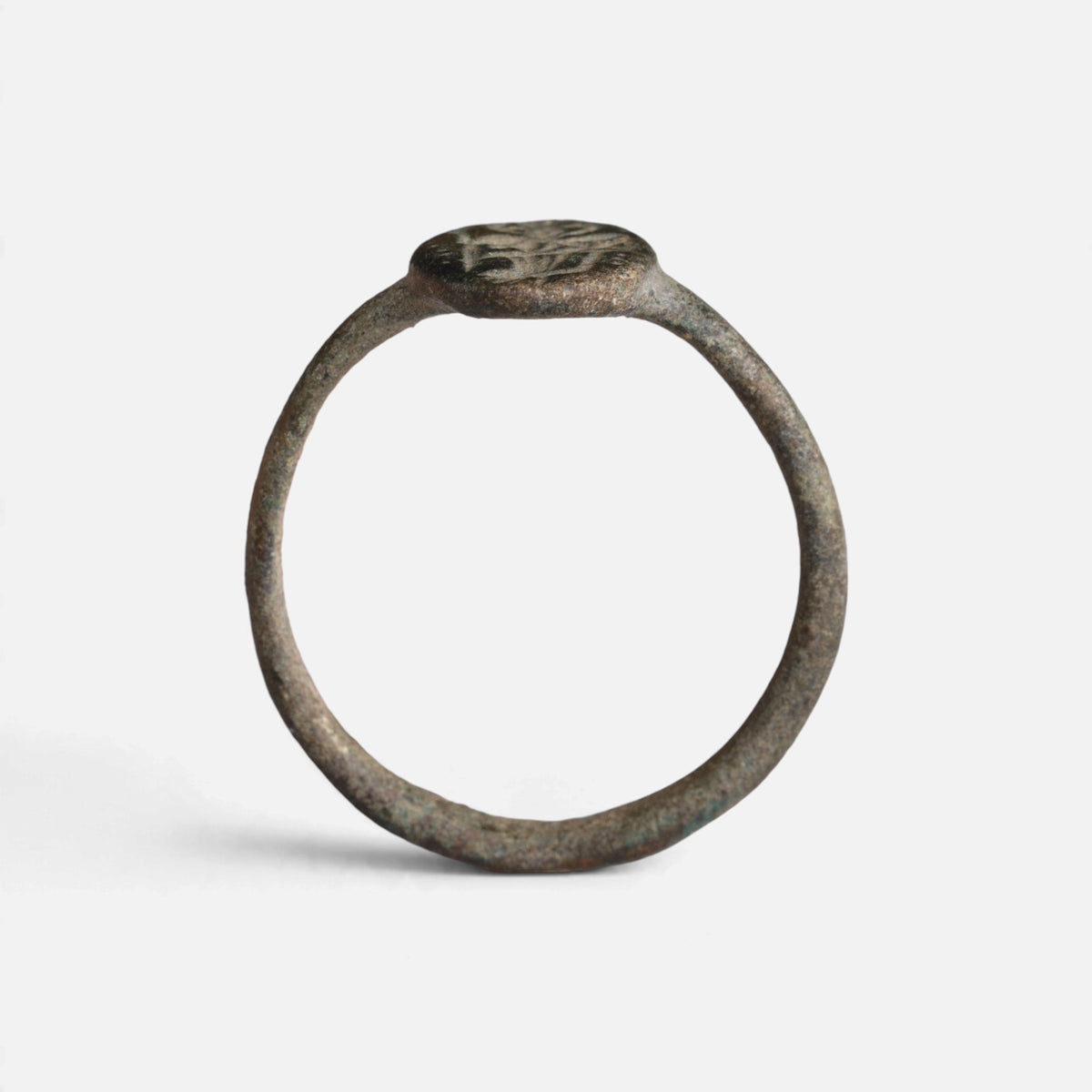 Byzantine bronze ring 'Kassia' shows its complete hoop and the oval bezel edge in profile.