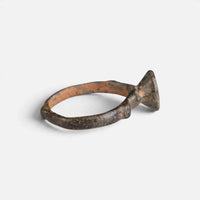 Byzantine bronze ring 'Monogrammos' shows its round bezel edge and narrow hoop from the side.
