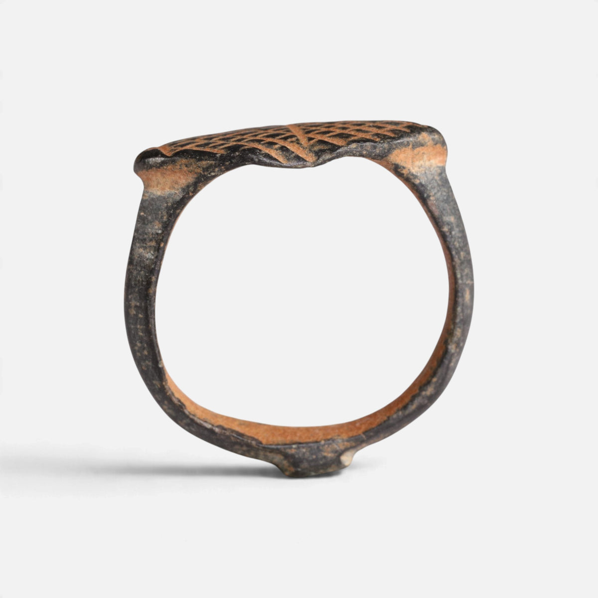 Medieval bronze ring 'Rhombulus' shows its complete hoop and the thin navette bezel edge in profile.