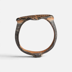 Medieval bronze ring 'Rhombulus' shows its complete hoop and the thin navette bezel edge in profile.