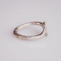 Profile view of medieval silver ring Ruslan revealing D-section hoop and integral bezel