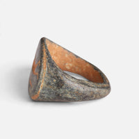 Roman bronze ring 'Mercurialis' shows its oval bezel edge and broad hoop from the side.
