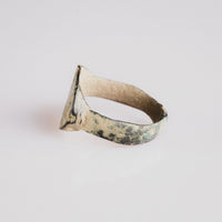 Rear side view of Roman bronze ring Numerius with malachite green and tenorite patina