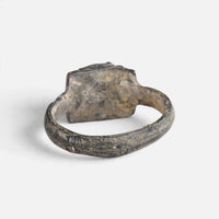 Medieval bronze ring 'Aldonza' shows the plain back of its raised setting and the inner hoop.