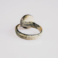 Rear view of medieval bronze ring 'Aldric' with malachite patina and calcareous soil deposits