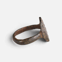 Medieval bronze ring 'Anselm' shows its thin bezel edge and hoop from the side.