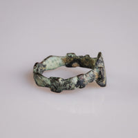 Rear view of medieval bronze ring Quintus showing full ribbed hoop and cast construction