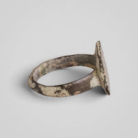 Rear view of medieval bronze ring Radvan showing hoop underside and calcareous deposits
