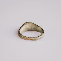 Rear view of medieval bronze ring Vetrona showing tapered hoop and interior encrustations
