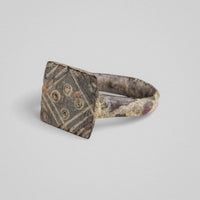 Reverse angle of medieval bronze ring Radvan showing hoop cross-section and patina variation