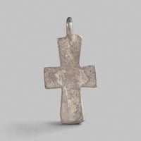 Reverse of Byzantine silver cross pendant Peristeria, plain surface with mineral encrustations