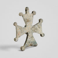 Reverse of Medieval bronze cross pendant 'Gemmata' showing plain plate and integral suspension loop at the top arm.