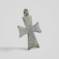 Reverse of medieval bronze cross pendant 'Okellos' with plain surface and green patina