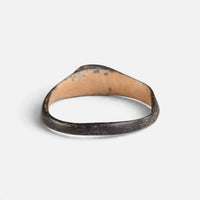 Byzantine bronze ring 'Isidoros' shows the plain back of its small bezel and the inner hoop.