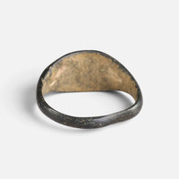 Medieval bronze ring 'Aldhelm' shows its inner shoulders and the plain back of the bezel.