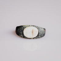 Roman bronze intaglio ring Numerius with white stone bezel and altar motif, top view