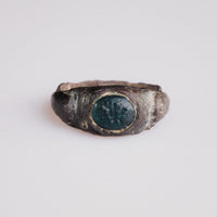 Roman bronze intaglio ring Volusenus with blue-green glass paste bezel, front view