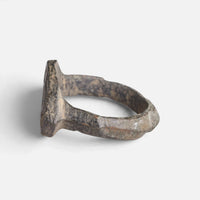 Roman bronze ring 'Cassia' shows its bezel edge and broad shoulder from the opposite side.