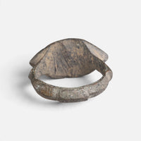 Roman bronze ring 'Cassia' shows the plain back of its pointed oval bezel and the inner hoop.