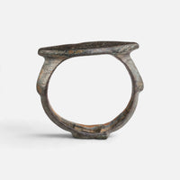 Roman bronze ring 'Catulla' shows its complete hoop and the pointed oval bezel edge in profile.