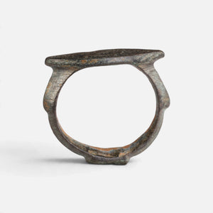 Roman bronze ring 'Catulla' shows its complete hoop and the pointed oval bezel edge in profile.