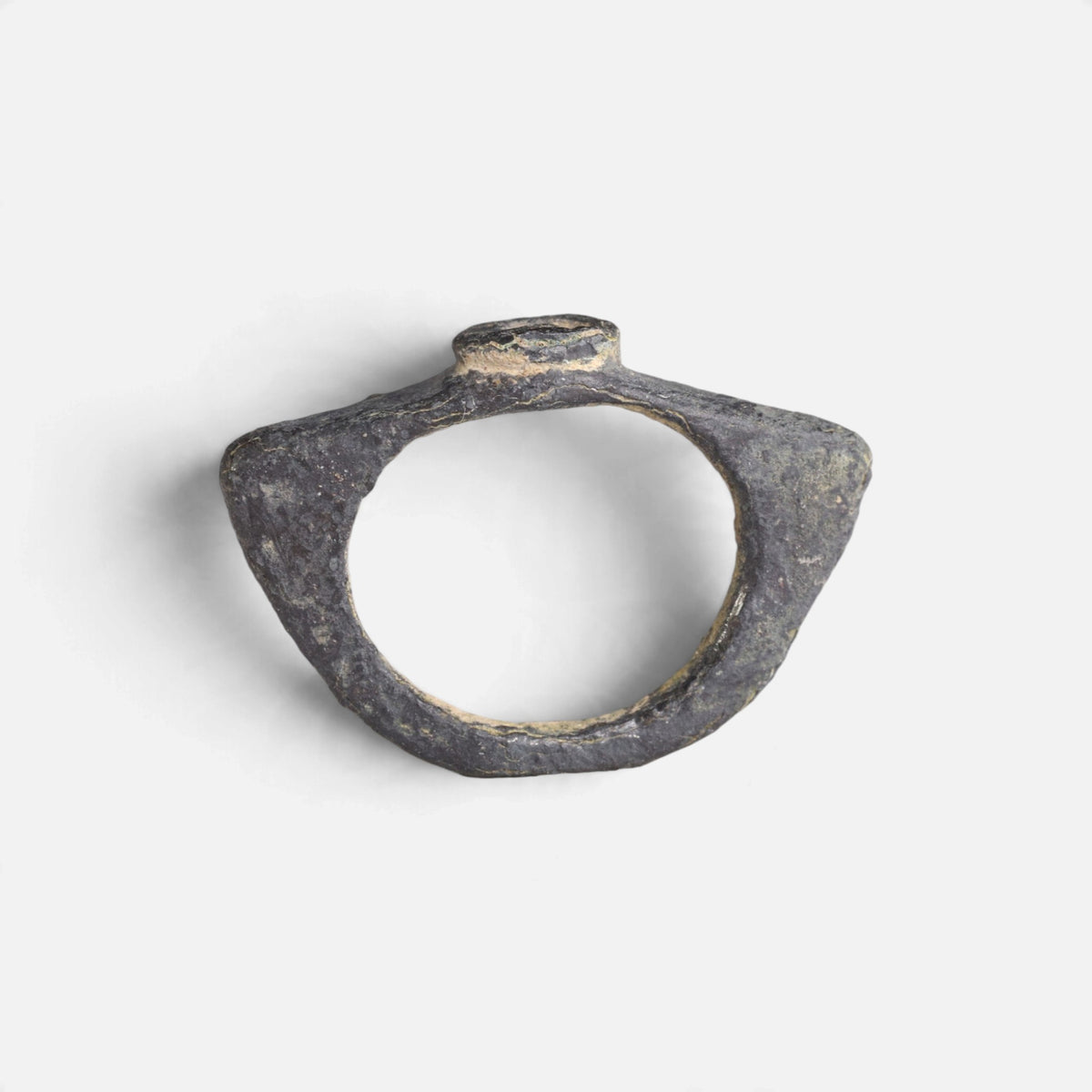 Roman bronze ring 'Equidus' shows its angular hoop and the small raised bezel edge in profile.
