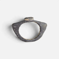 Roman bronze ring 'Equidus' shows its angular hoop and the small raised bezel edge in profile.
