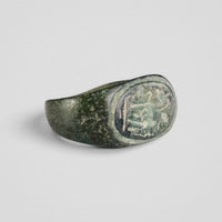 Roman bronze ring Equinor, angled view of the bezel with softened relief and patina