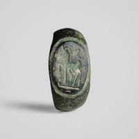 Roman bronze ring Equinor, close view of the raised oval bezel and horse-and-rider device