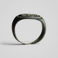 Roman bronze ring Equinor, profile view showing hoop shoulders and integral bezel