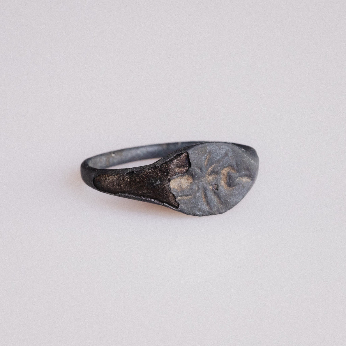 Roman bronze ring Formica showing engraving detail and dark patina on navette bezel