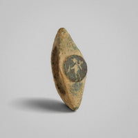 Roman bronze ring Verecundus, oblique view of raised disc bezel with engraved standing figure