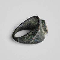 Roman bronze ring Vultinus, opposite three-quarter view showing dark patina and hoop profile