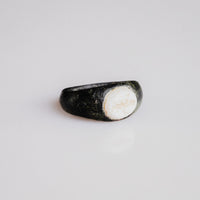 Roman bronze ring Velthur, three-quarter view showing D-section hoop and set stone