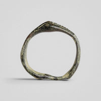 Roman bronze ring Vindex, upright view of the gabled head and the pinched, out-of-round hoop