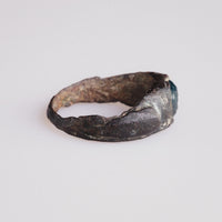 Roman bronze ring Volusenus profile view revealing D-section hoop and dense patina