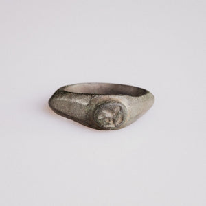 Roman bronze signet ring Corvellus with engraved bird-on-branch oval bezel, front view